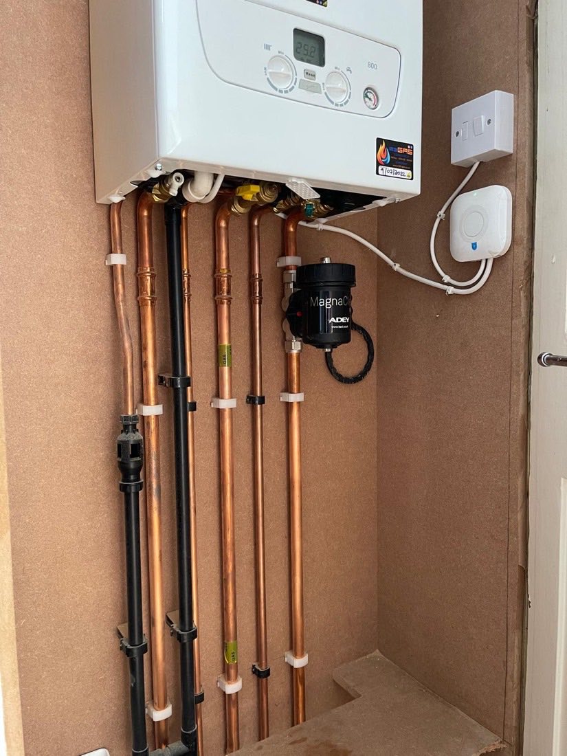 A Baxi combi boiler installed with tidy copper pipework, clipped and labelled
